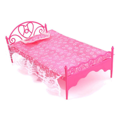 Mini pink plastic doll bed with floral mattress, lace trim, scroll headboard and side rails