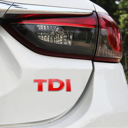 Red TDI letters 3D chrome badge decal sticker on white car rear light area