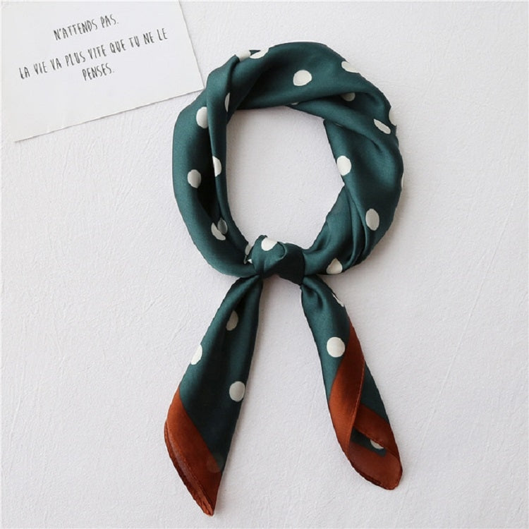 Dark green silk square scarf with white polka dots, tied knot presentation