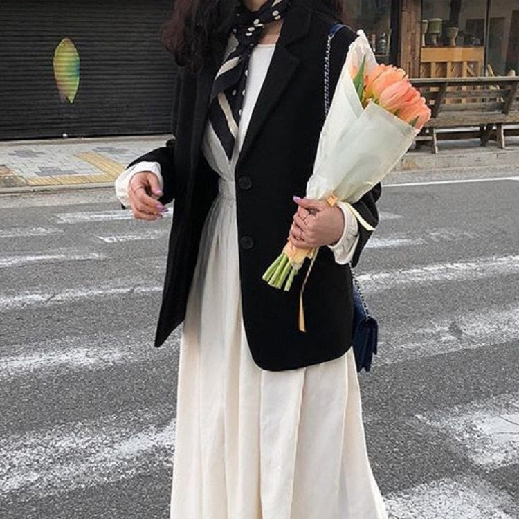 Silk scarf with black-and-white dot pattern, worn with blazer and long dress