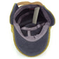 Mustard corduroy bomber hat interior with gray lining and adjustable strap