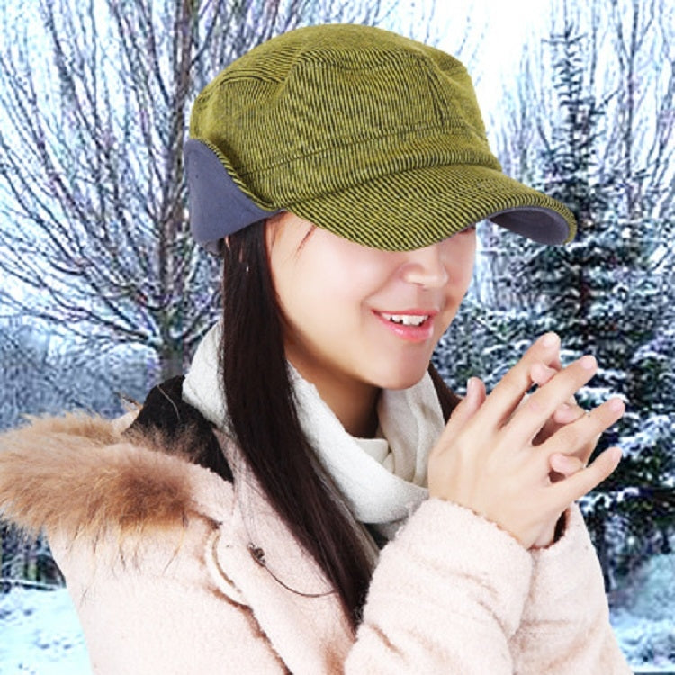 Mustard corduroy bomber hat worn by person with winter coat