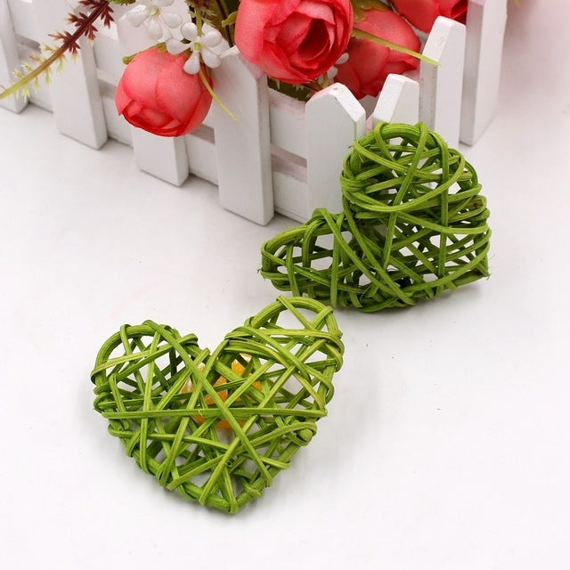 Green woven rattan heart ornaments, pair of crisscross straw hearts.