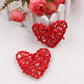 Red rattan heart ornaments, two woven straw hearts with crisscross lattice.