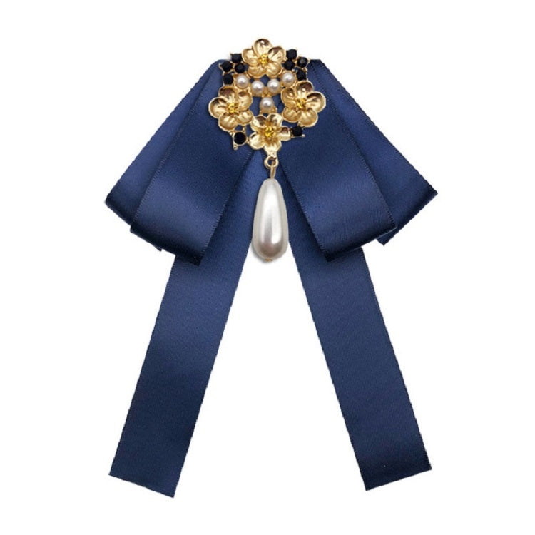 Navy fabric bow with gold pearl and rhinestone floral brooch, dangling teardrop pearl