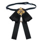 Black satin bow brooch with pearl rhinestone floral centerpiece and teardrop pearl strap