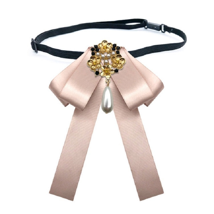 Champagne satin bow tie belt with gold and pearl cross centerpiece
