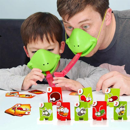Kids playing lizard tongue game with green lizard masks, red tongue props, and card tiles.