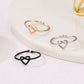 Set of adjustable heart hollow rings in black, silver, and gold
