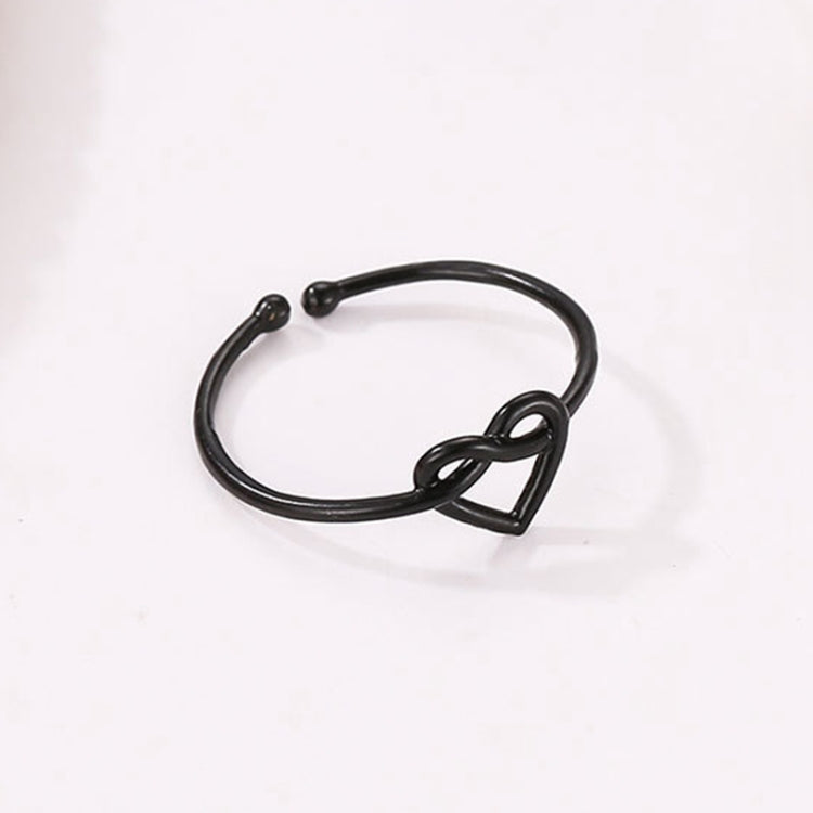 Adjustable black heart hollow ring with open loop band and heart cutout