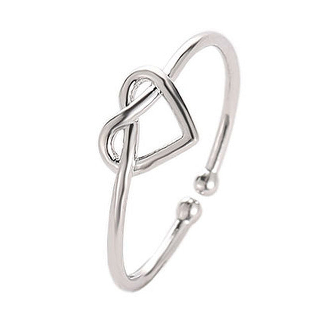 Silver adjustable heart hollow ring with open loop band and heart cutout