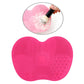 Pink silicone heart brush cleaning mat with textured cleaning zones for bristles