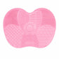 Pink silicone heart-shaped brush cleaner mat close-up with spiral and heart textures