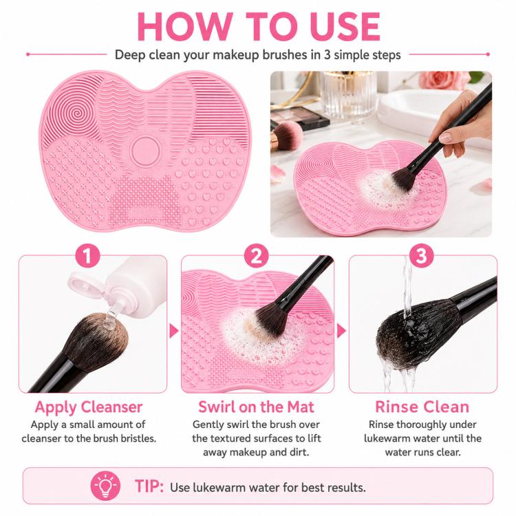 Pink silicone heart brush cleaning mat shown with makeup brush swirling and rinsing