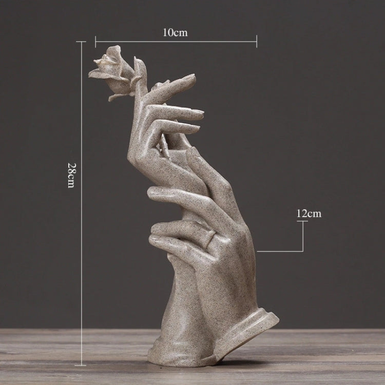 Abstract light-gray hands sculpture with rose, approx. 10cm tall (as shown).