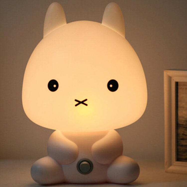 Rabbit-shaped LED night light lamp with glowing face and round touch button