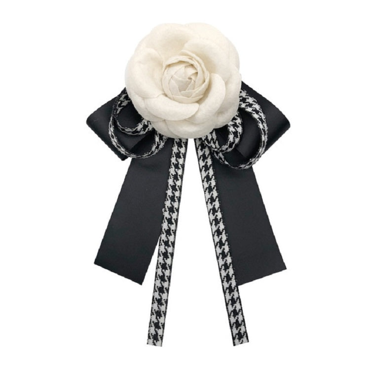 3D rose bow knot brooch featuring black ribbon loops and white-black patterned tails