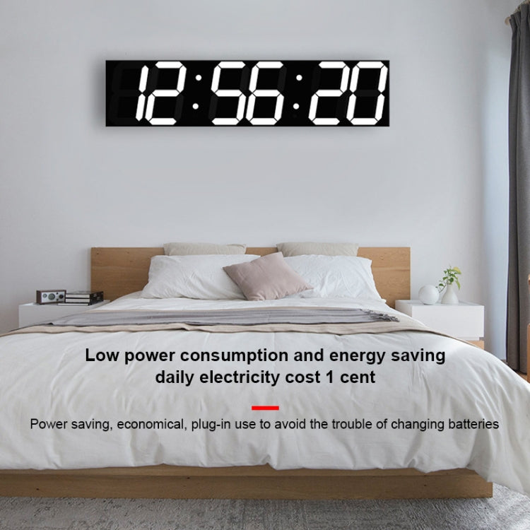 LED digital wall clock with white segmented digits reading 12:56:29 on wall