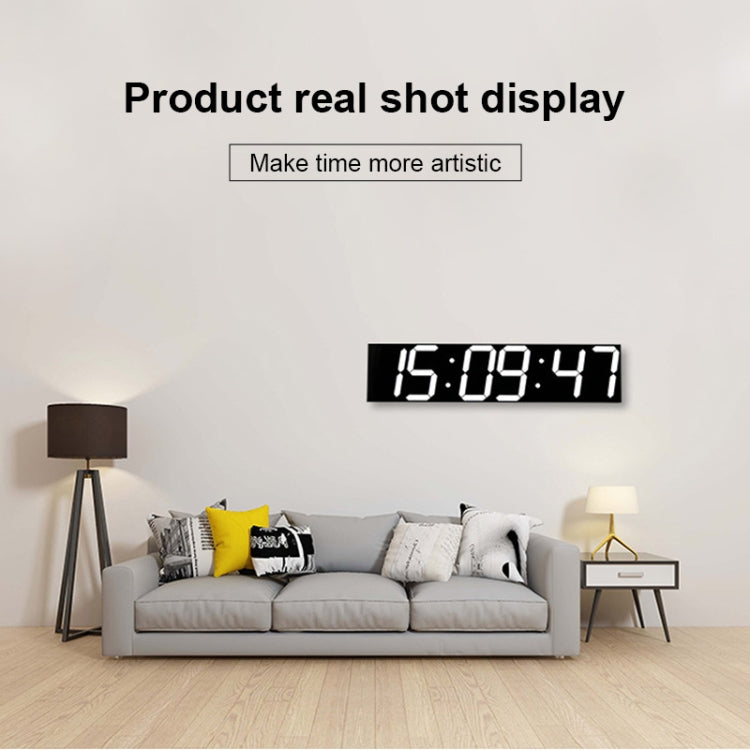 LED digital wall clock with white digits on black panel reading 15:09:47