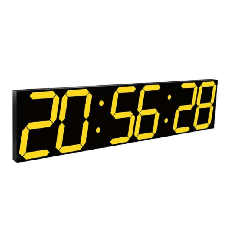 LED digital wall clock close-up with yellow digits on black panel