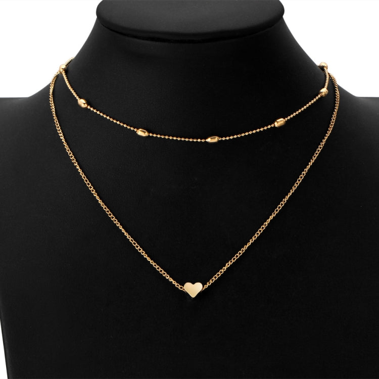 Gold multi-layer heart clavicle necklace with bead accents and heart pendants