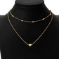 Gold two-chain heart clavicle necklace with small center heart pendant