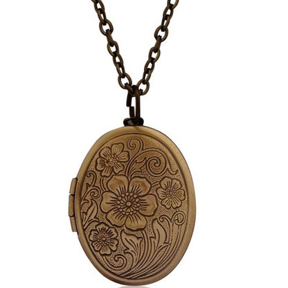 Antique bronze oval locket necklace with engraved floral pattern and link chain