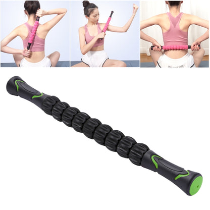 Black and green segmented massage roller stick for muscle soreness relief.