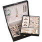 Black double-layer jewelry storage box open with divided trays for rings, bracelets, and watches