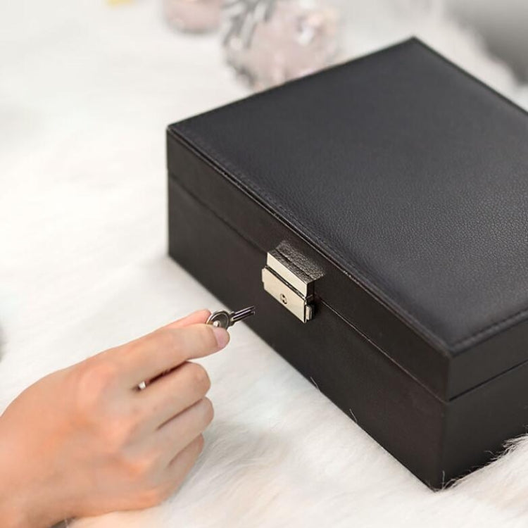 Black double-layer jewelry storage box with hinged lid and metal clasp closure