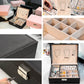 Black and pink double-layer jewelry storage box interiors with multi-compartment organizers