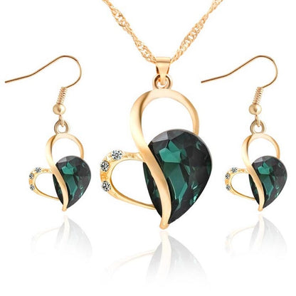 Gold-tone heart crystal pendant necklace set with matching drop earrings, green gemstone