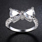 Silver bowknot zircon ring with two side marquise stones and a sparkling center bow