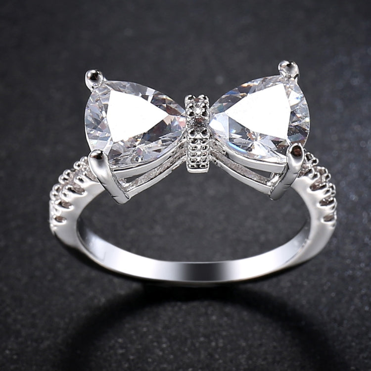 Silver bowknot zircon ring with two side marquise stones and a sparkling center bow