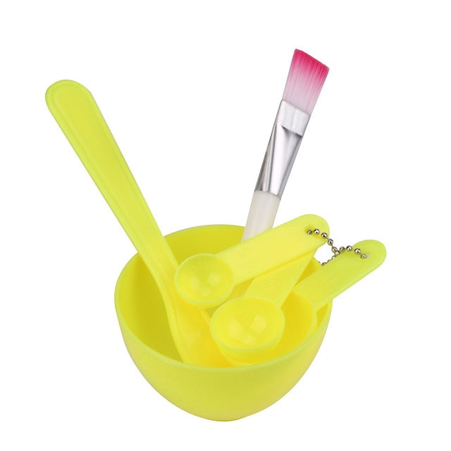 DIY facial mask mixing bowl set with light yellow bowl and brush, spoon, and stick tools