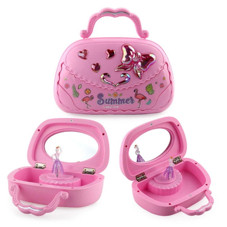 Pink handbag-style music jewelry box with ballerina cutout and heart decorations