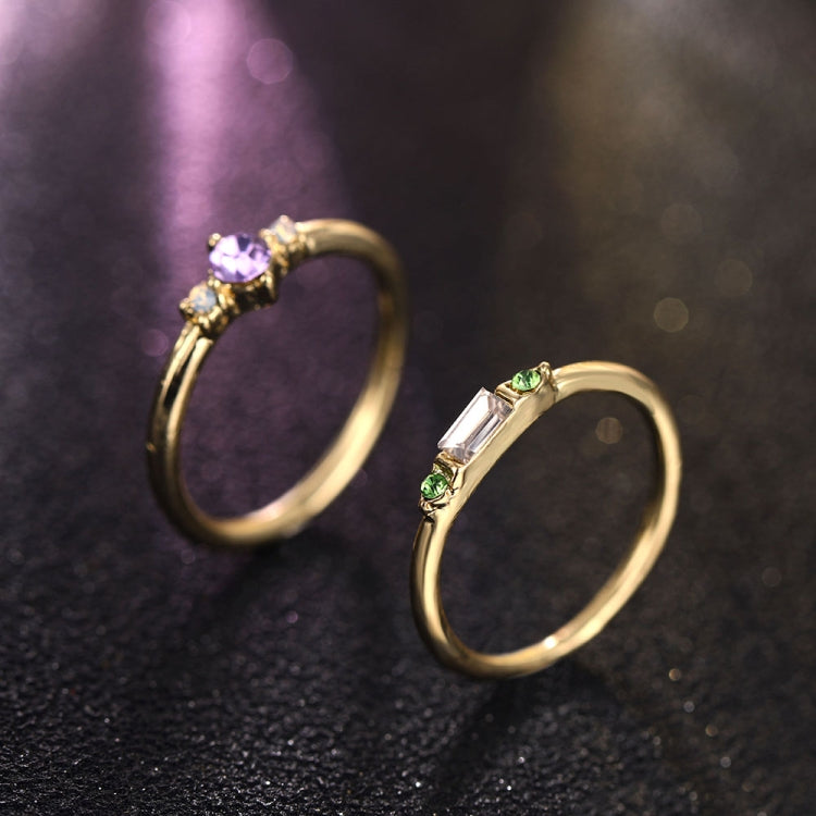 Gold-tone open crystal rings with purple round stone and green rectangular stone details