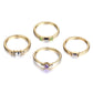 4-piece gold-tone crystal zircon ring set with green, purple, and clear stones