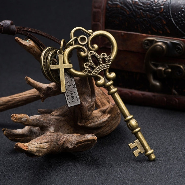 Antique-style crown key pendant with heart charm, ribbon cord, and hanging keys