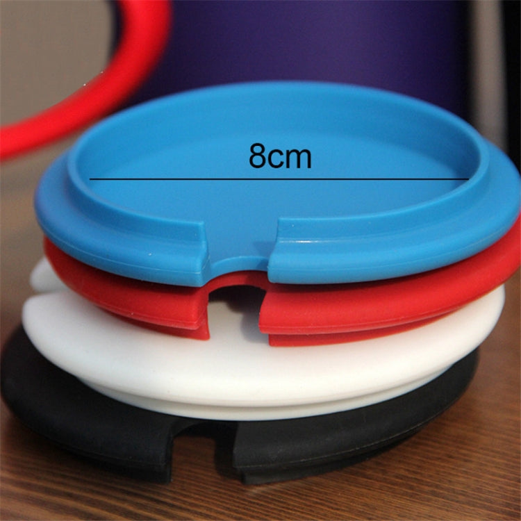 Blue silicone cup covers stacked on a mug, with vent gap