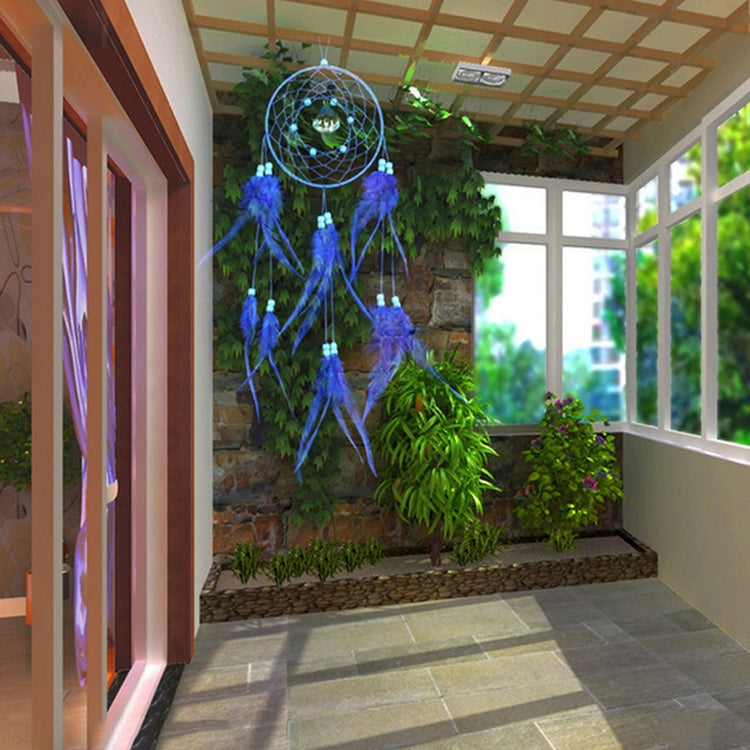 Blue dream catcher wall hanging with woven hoop and dangling feather tassels