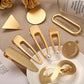 Assorted gold metal snap hair clips with decorative shapes and pearl accents