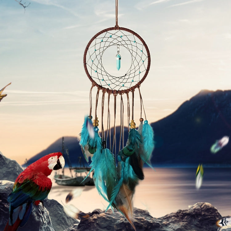 Dreamcatcher wall hanging with white web, turquoise feathers, teal drop charm, brown ring