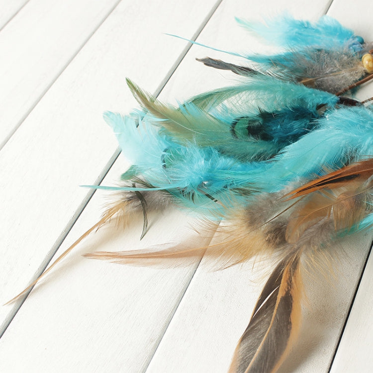 Turquoise and tan feather fringe on dreamcatcher web with teal bead accents