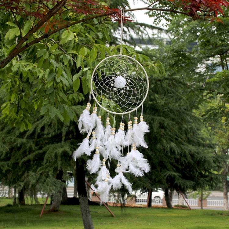 White dreamcatcher ornament with round web hoop, bead strands, and fluffy feather tassels.