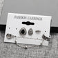 Assorted silver-tone fashion earrings set on card: oval stud, textured bead, crown
