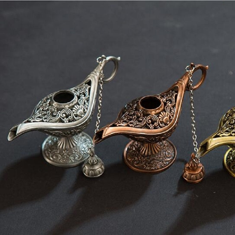 Silver and bronze metal wish lamps with curved spouts and hanging chains