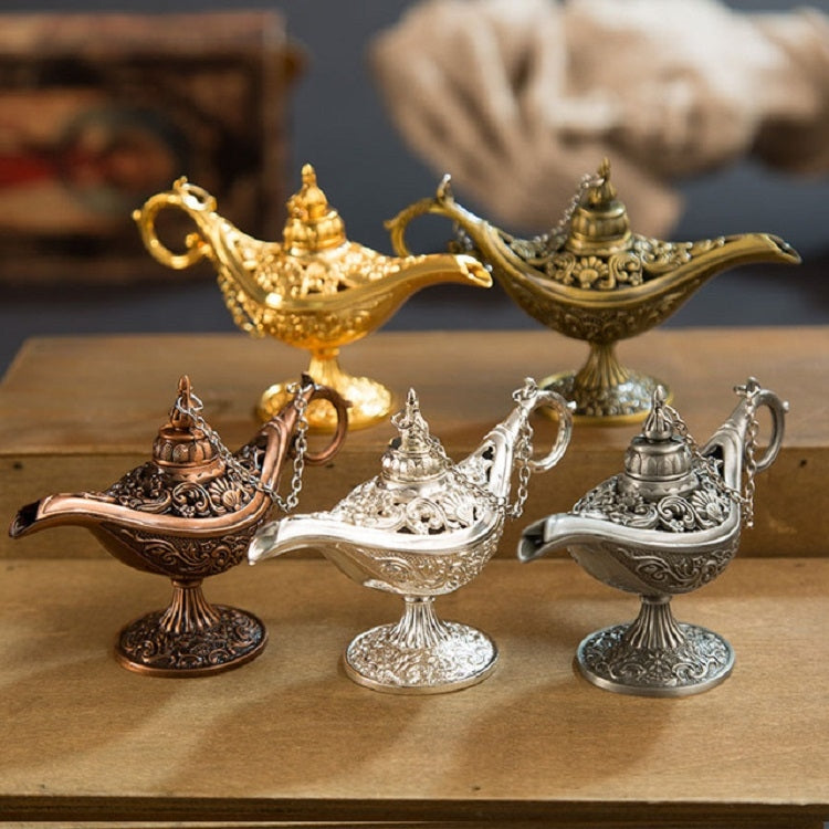 Set of gold, bronze, silver, and copper metal wish lamps with chained handles