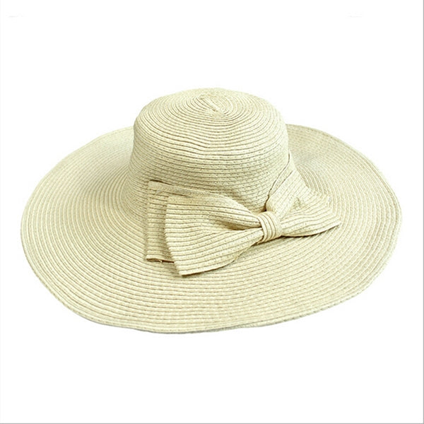 Girls wide-brim straw sun hat with tied fabric bow, light beige.