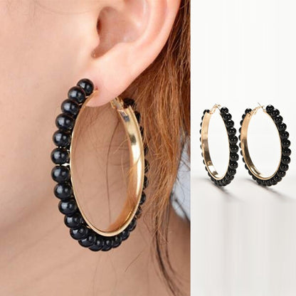 Girls hoop pearl earrings with gold oval hoop and black beaded fringe
